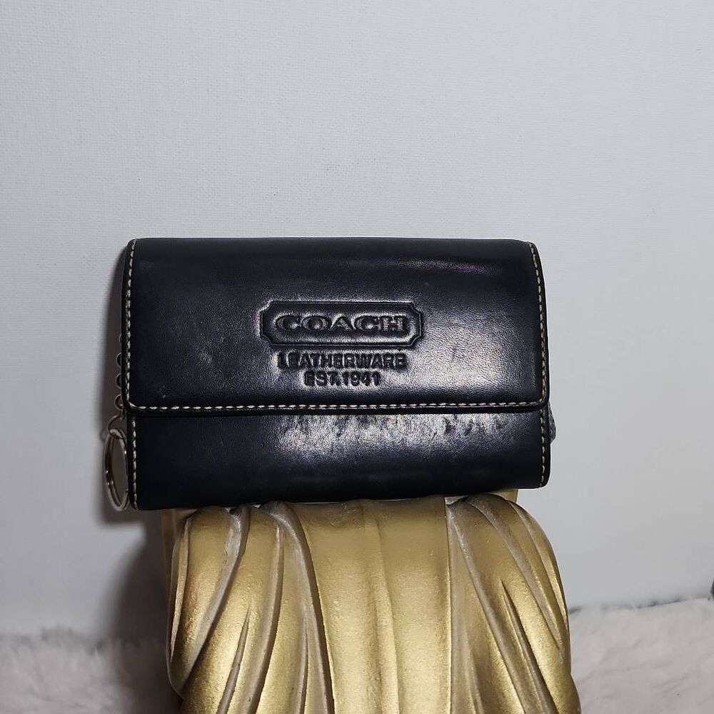 Vintage Coach Leatherware wallet with embossed "Est. 1941" logo.